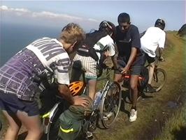 James and Ryan help Lee to ride Ryan's Romany touring bike, on the coast path from Hunter's Inn to Woody Bay